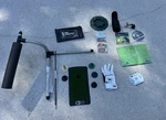 Golf Training Aid Lot: Pelz Putter, Swing Detective, Inside Approach, Sklz Glove. Fixed Price $115.00.