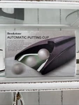 Brookstone Automatic Return Putting Cup, New. Fixed Price $18.99.