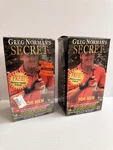 (2) Greg Norman Secret Golf Swing Training Aid W/ Demo Vhs Tape Lot Sealed!. Fixed Price $32.00.